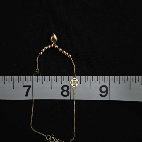 18k Bracelet with small balls and cute money catcher design as charm - Picture 8 of 16